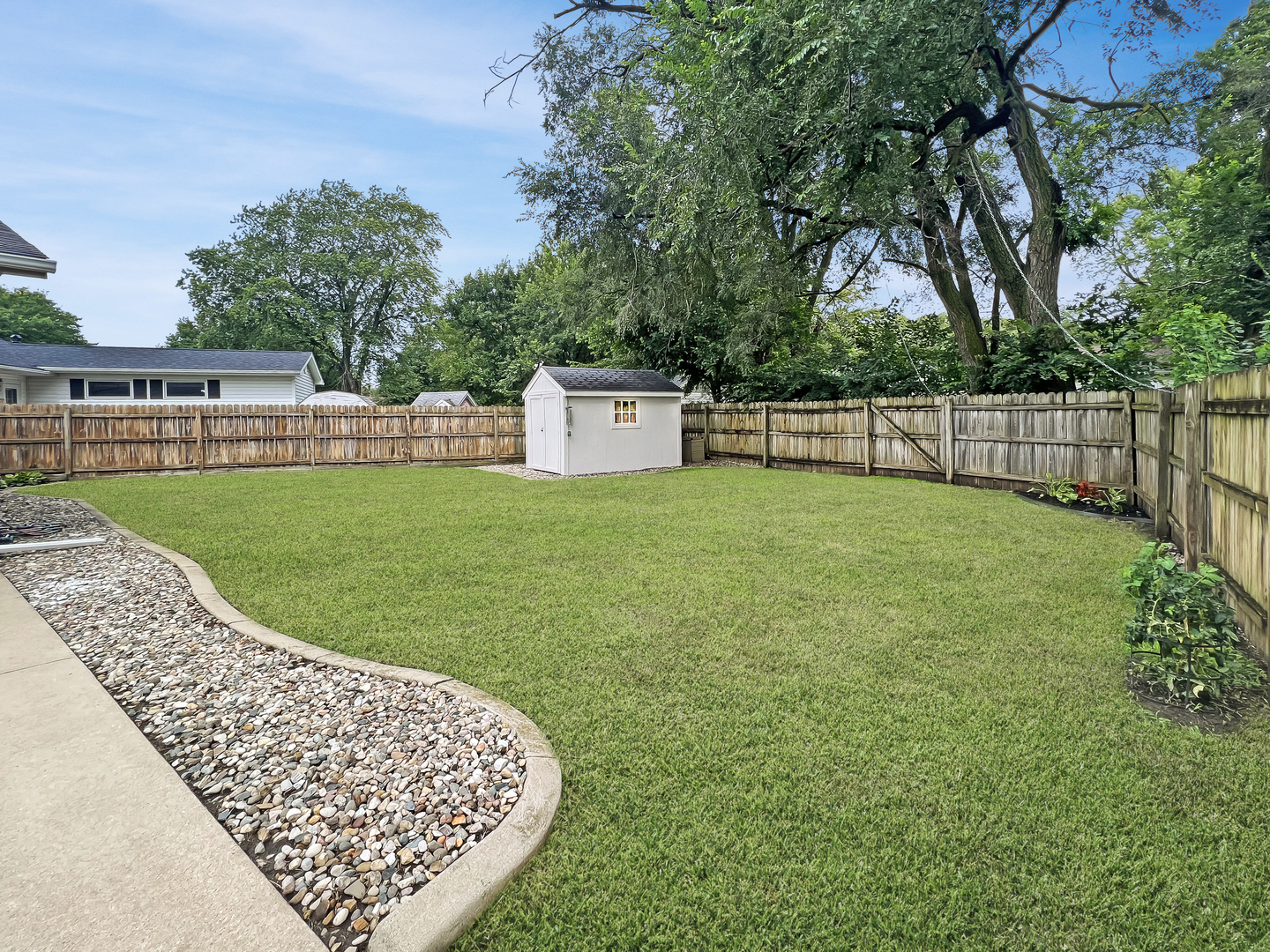 1201 Clark Street Rantoul, IL 61866 - Photo 24 of 24 a view of a backyard with a small cabin
