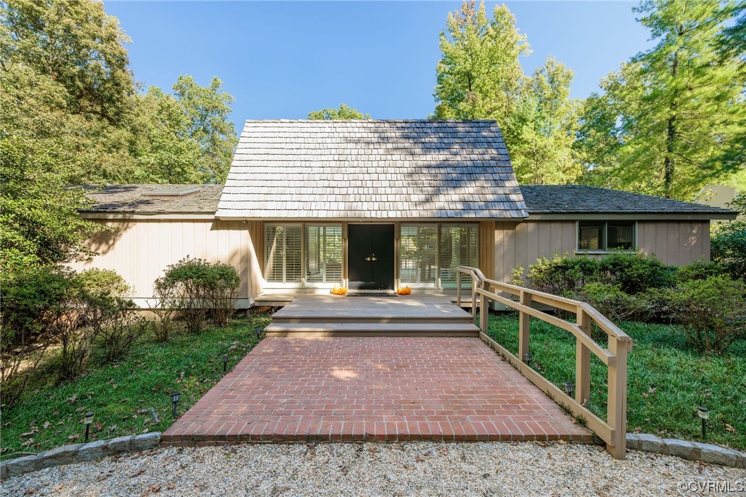 a front view of a house with garden