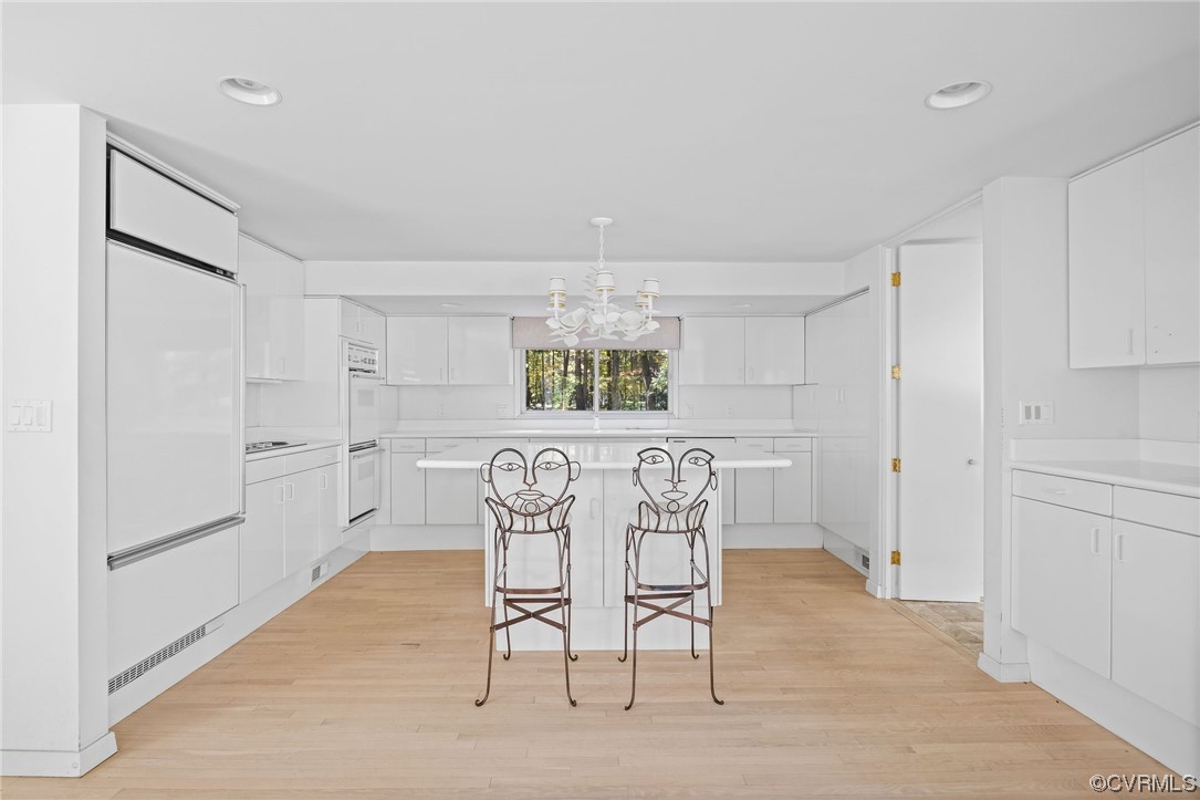 2831 West Brigstock Road Midlothian, VA 23113 - Photo 20 of 49 a view of a dining room that has a table and chairs in it