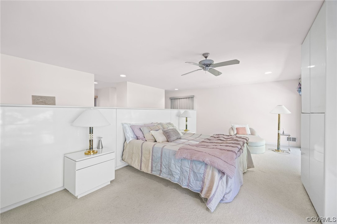 2831 West Brigstock Road Midlothian, VA 23113 - Photo 32 of 49 a spacious bedroom with a bed and a ceiling fan