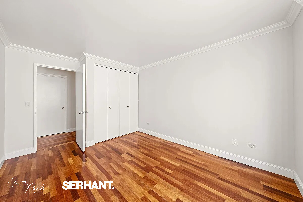 2 South End Avenue, Unit 6J Manhattan, NY 10280 - Photo 9 of 19 a view of a room with wooden floor