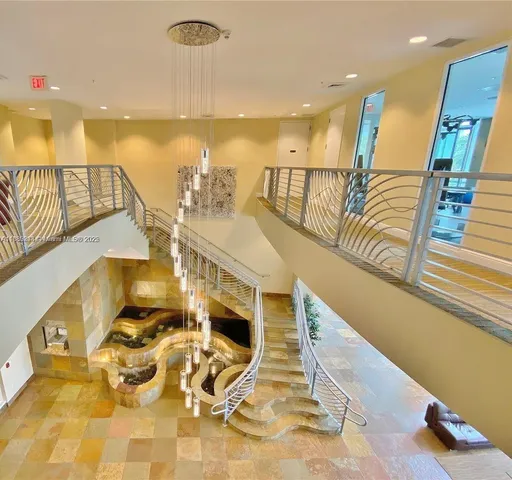 a view of a swimming pool and furniture