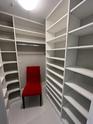a room with furniture and a book shelf