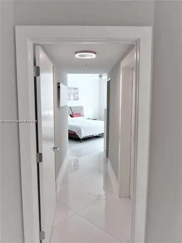 a en suite bathroom with a tub sink and mirror