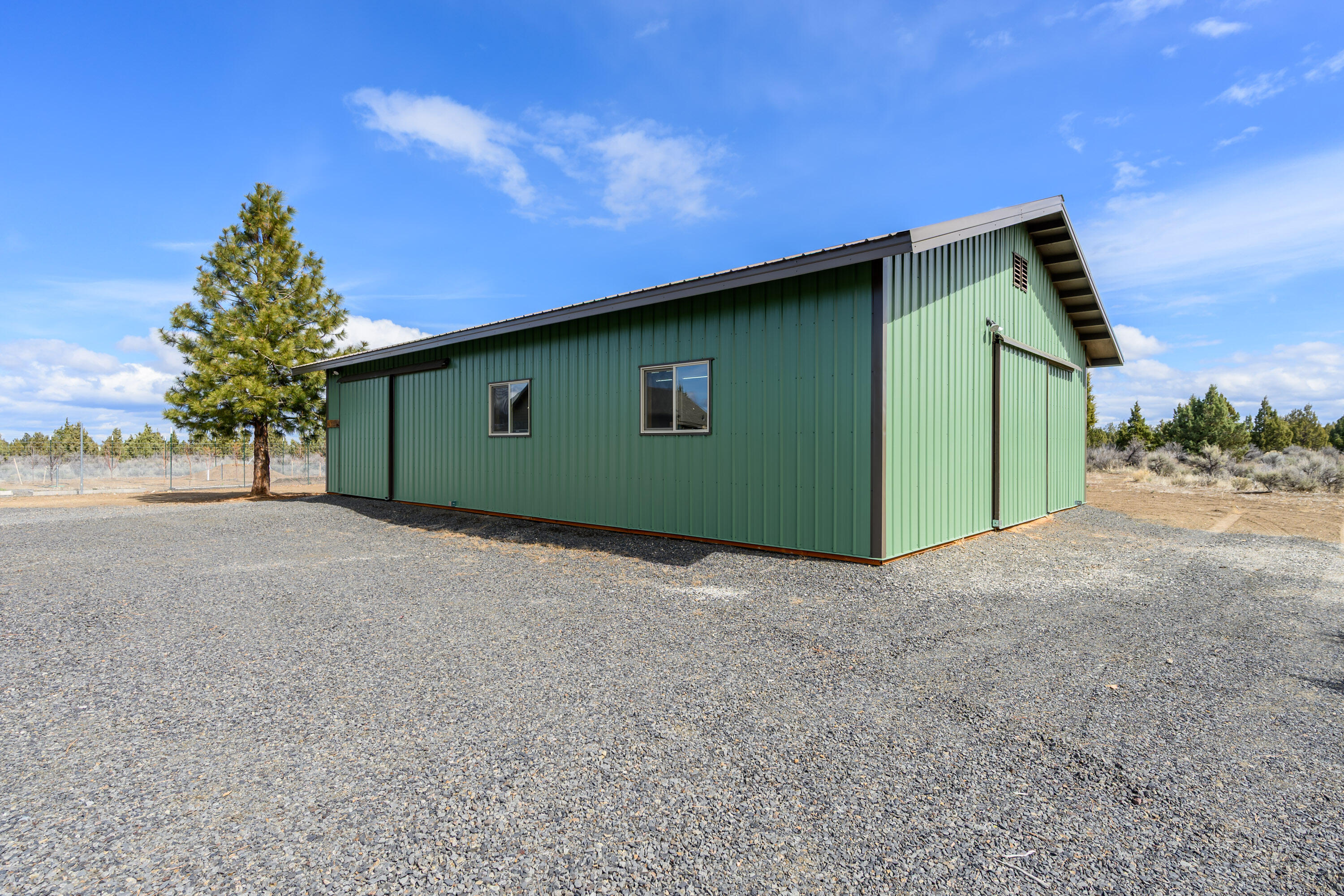 66360 Jericho Road Bend, OR 97703 - Photo 49 of 100 a green field with trees in the background