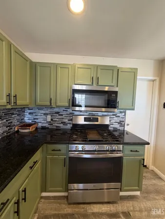 a kitchen with a stove and a sink