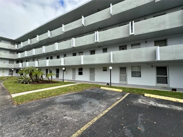 a front view of a building with a street