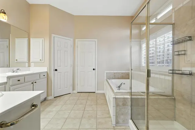 a bathroom with a bathtub and a sink