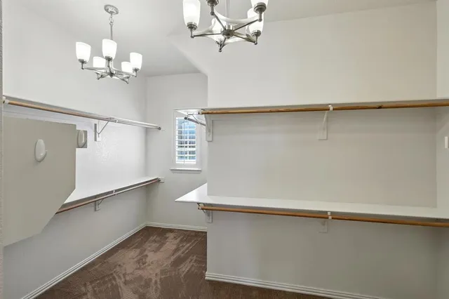 a view of a hallway with a chandelier