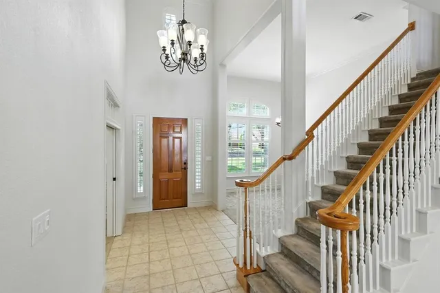 a view of entryway with wooden floor and stairs