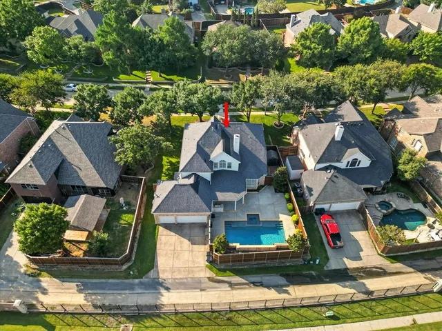 an aerial view of a swimming pool yard and outdoor seating
