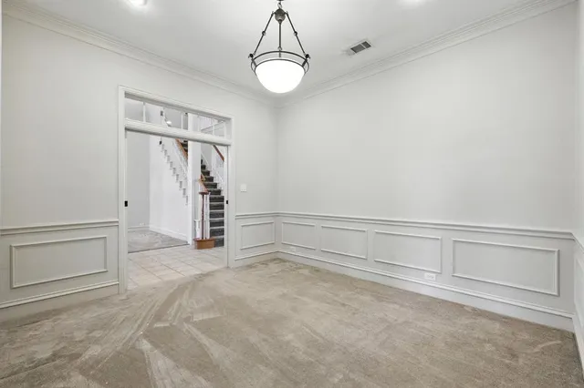 a view of an empty room with closet
