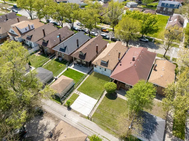 an aerial view of a house with a garden
