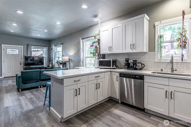 a kitchen with sink cabinets and window