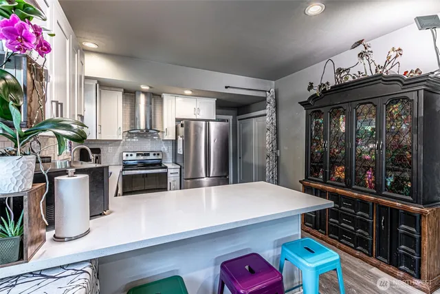 a kitchen with lots of counter top space and appliances