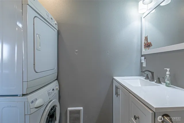a bathroom with a sink a vanity and a mirror