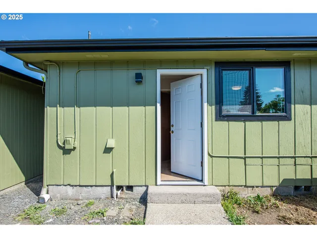 a view of a room with wooden walls