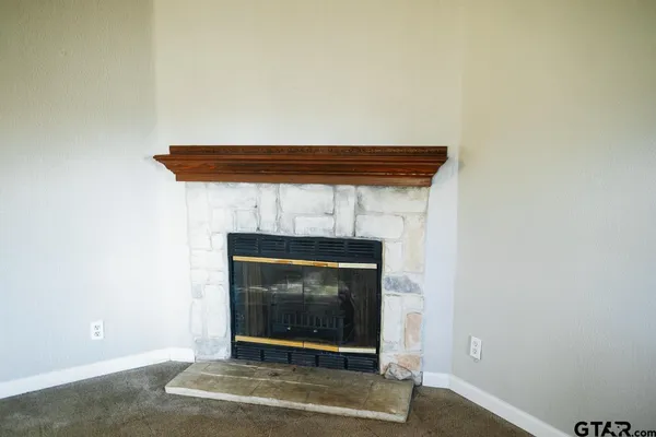 a living room with a fireplace