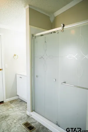 a bathroom with a sink vanity and mirror