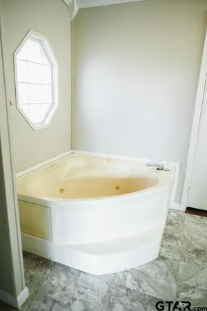 a bathroom with a toilet and a sink