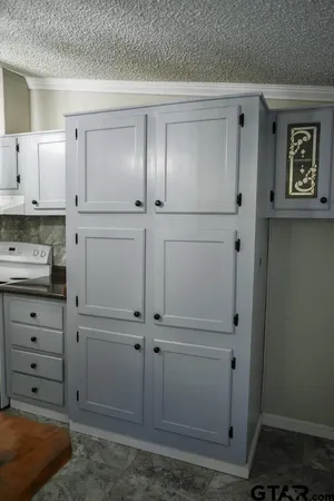 an empty room with wooden floor and window