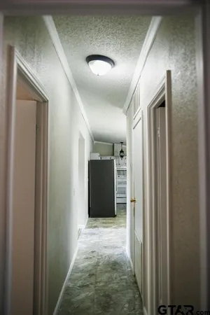 a utility room with a sink a toilet and a mirror