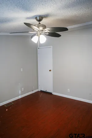 a view of a room with wooden floor