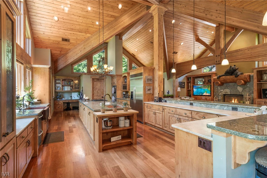 623 Tyner Way Incline Village, NV 89451 - Photo 11 of 35 a kitchen with stainless steel appliances granite countertop a stove and cabinets