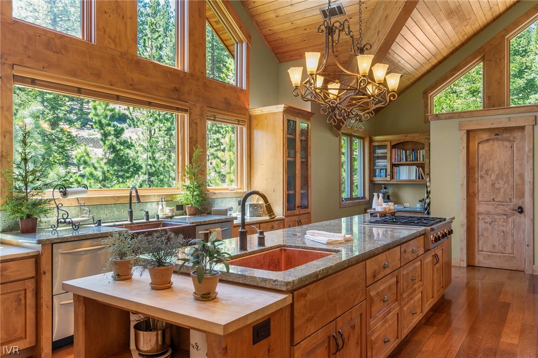 623 Tyner Way Incline Village, NV 89451 - Photo 12 of 35 a kitchen with kitchen island granite countertop a sink and a large window
