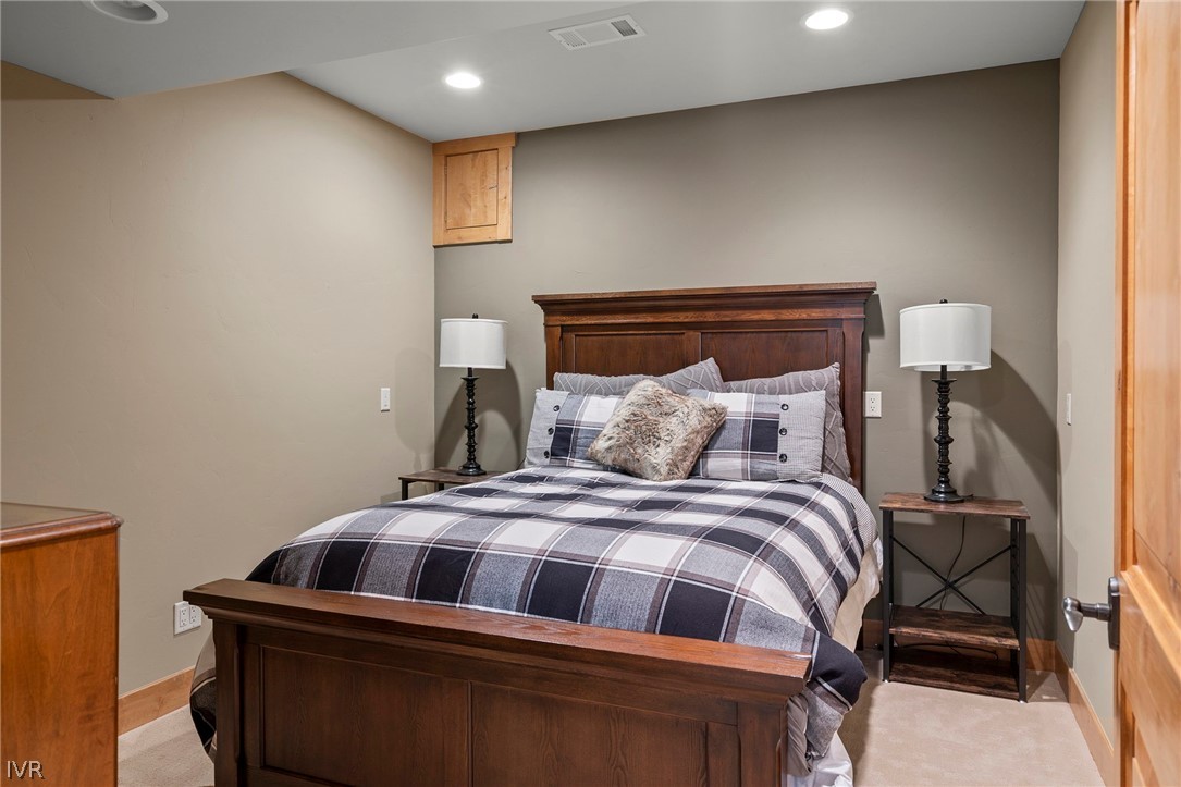 623 Tyner Way Incline Village, NV 89451 - Photo 23 of 35 a bedroom with a bed and a mirror