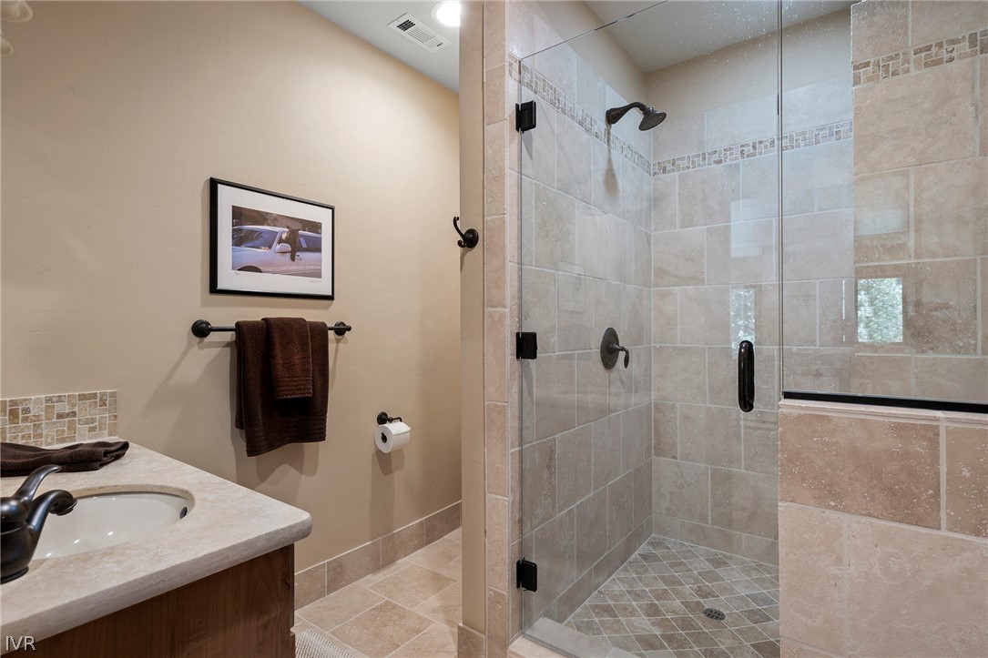 623 Tyner Way Incline Village, NV 89451 - Photo 24 of 35 a bathroom with a sink a shower and a mirror