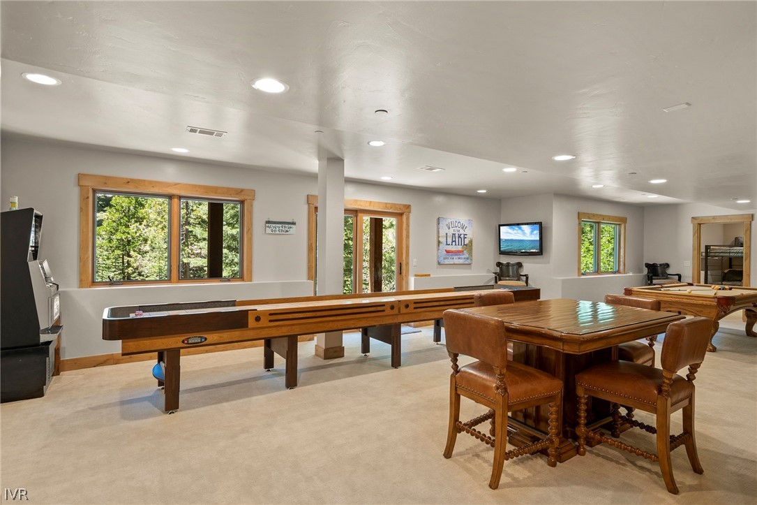 623 Tyner Way Incline Village, NV 89451 - Photo 25 of 35 a dining hall with stainless steel appliances a dining table and chairs with kitchen island