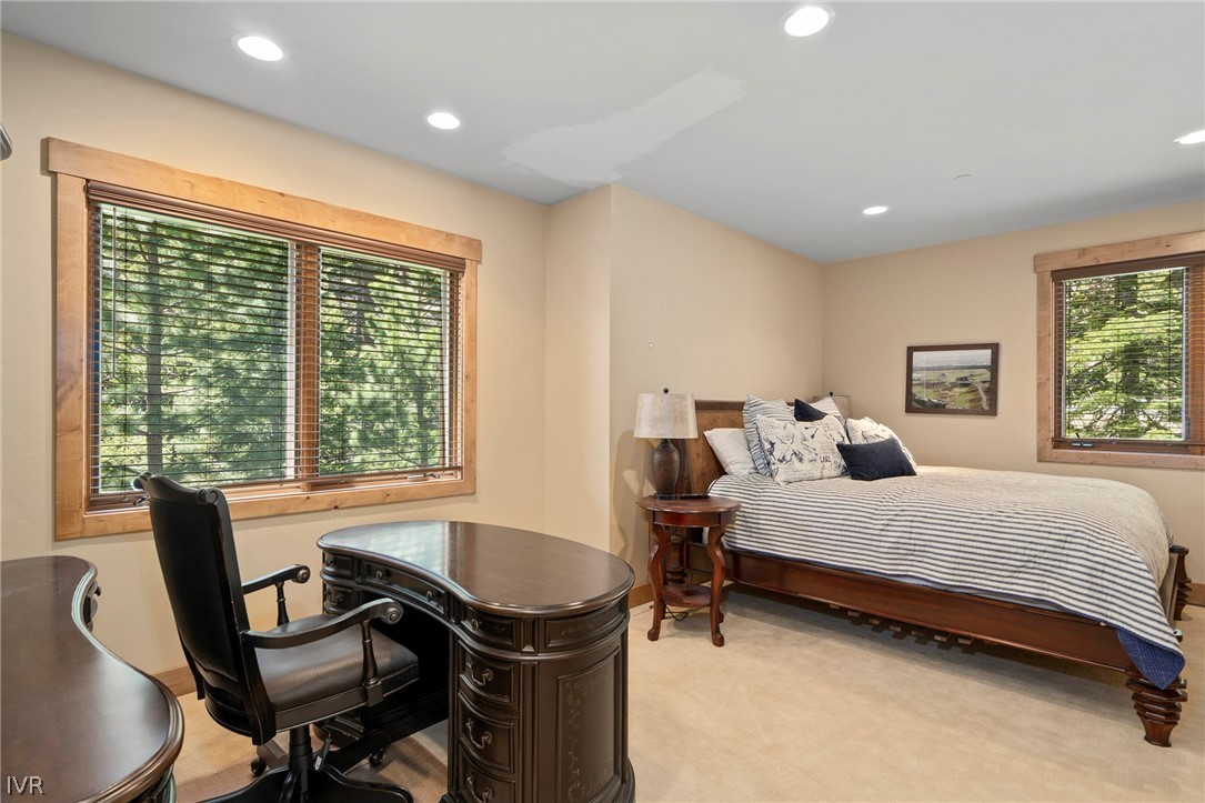 623 Tyner Way Incline Village, NV 89451 - Photo 28 of 35 a bedroom with a bed and a table