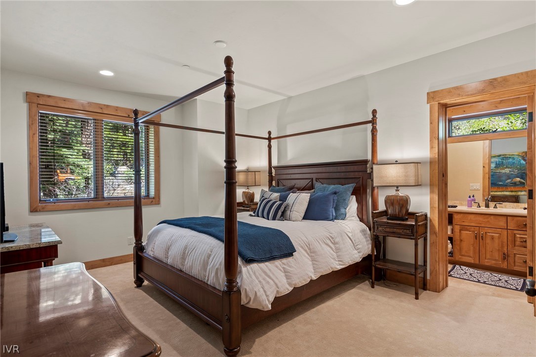 623 Tyner Way Incline Village, NV 89451 - Photo 29 of 35 a bedroom with a bed and wooden floor