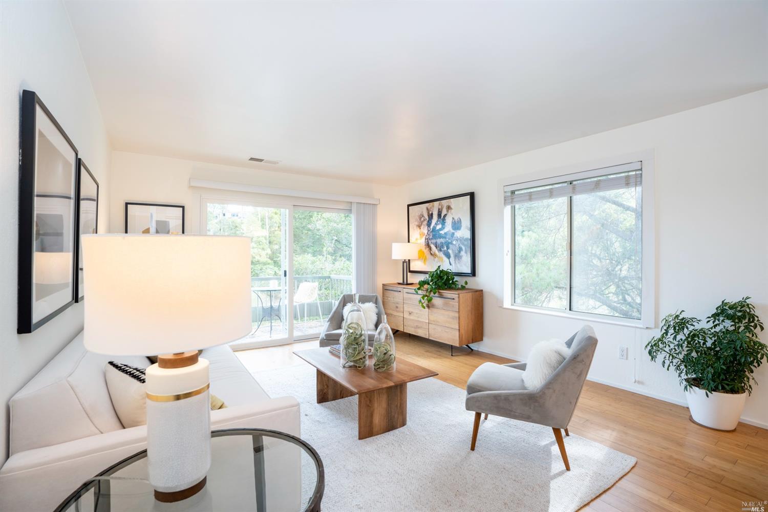 13 Anchorage Road Sausalito, CA 94965 - Photo 1 of 1 a living room with furniture and a large window