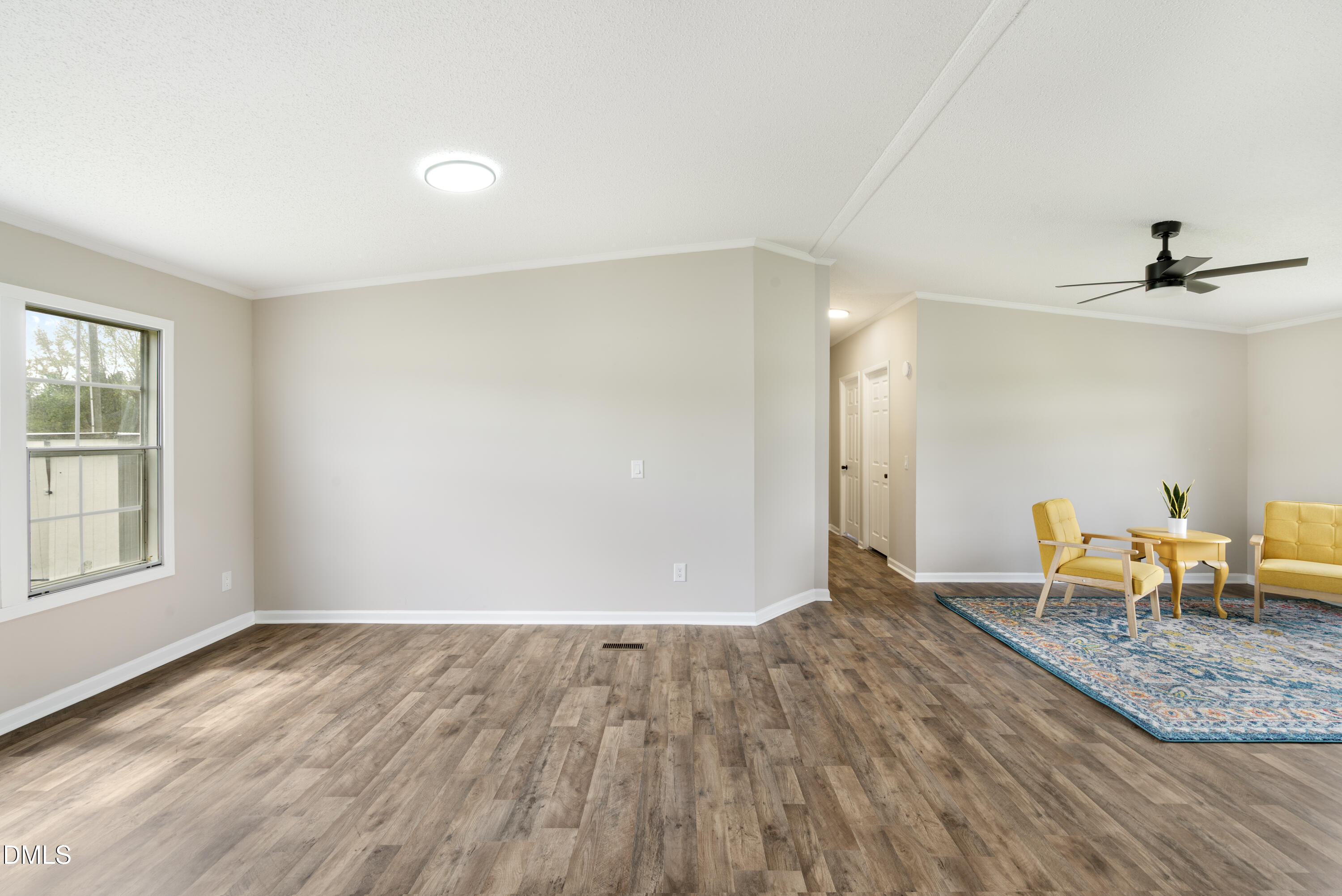 2048 Town Crier Road Kinston, NC 28504 - Photo 13 of 48 wooden floor in an empty room with a window