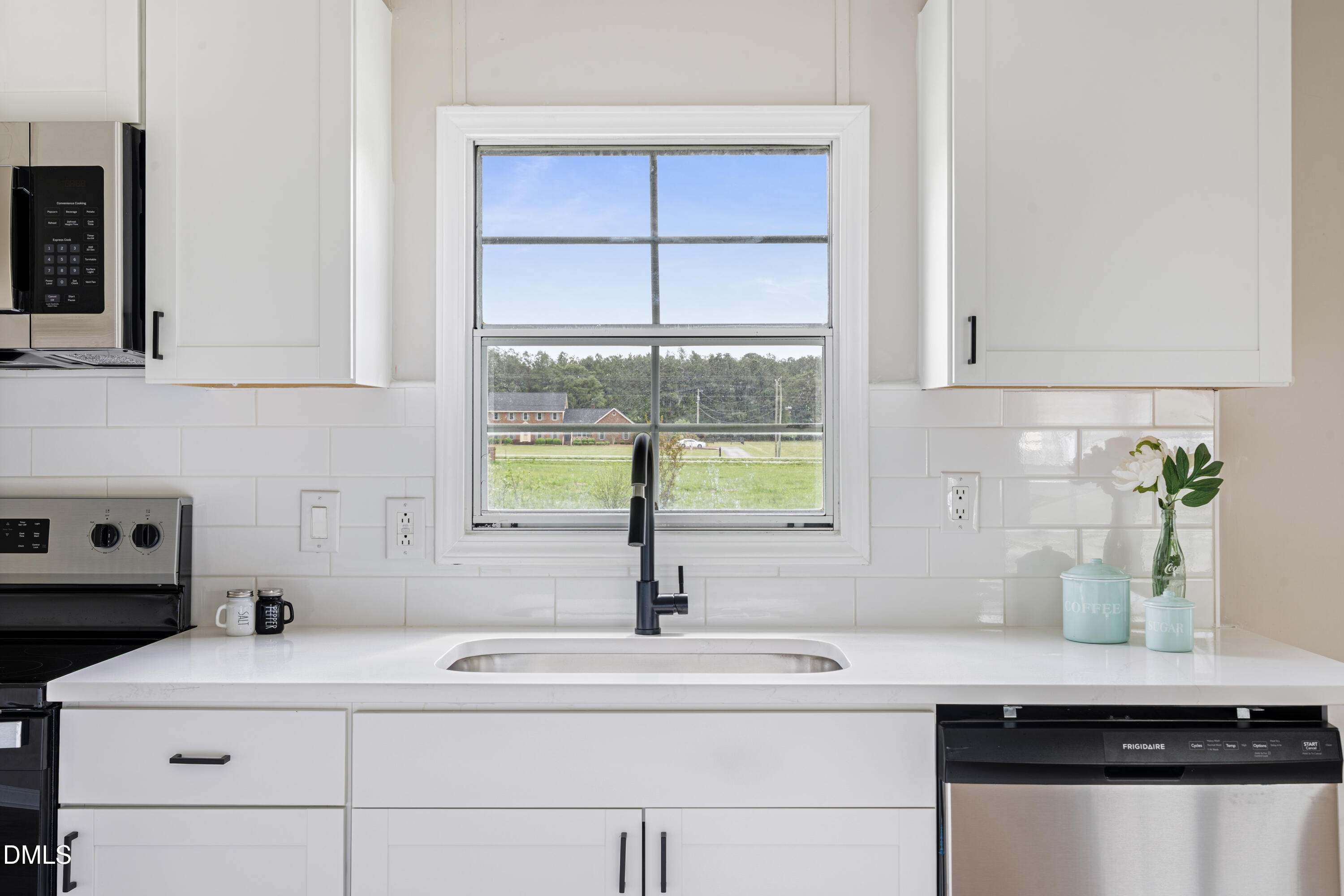 2048 Town Crier Road Kinston, NC 28504 - Photo 14 of 48 a kitchen with a sink and a window