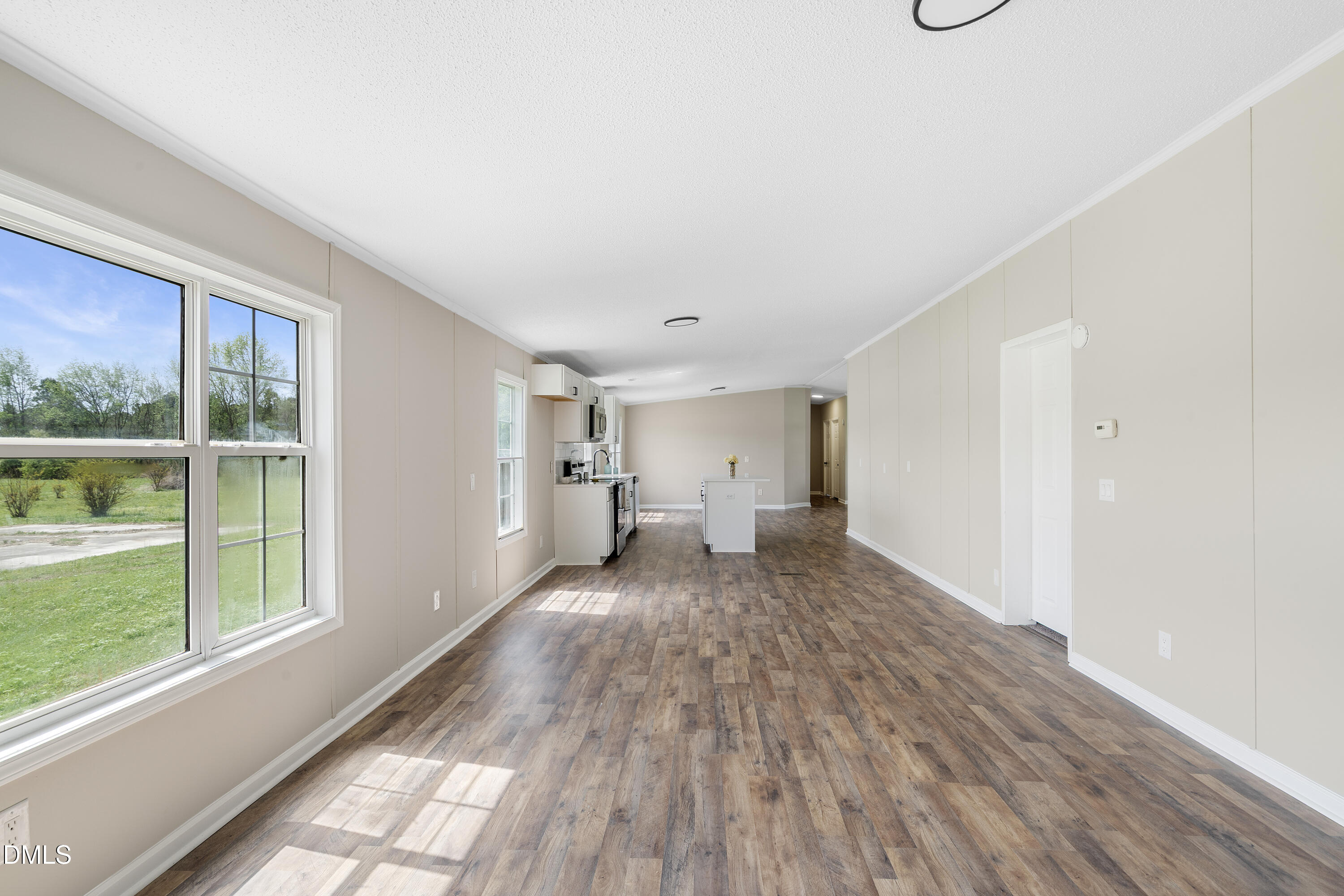 2048 Town Crier Road Kinston, NC 28504 - Photo 18 of 48 a view of a livingroom with wooden floor and a window