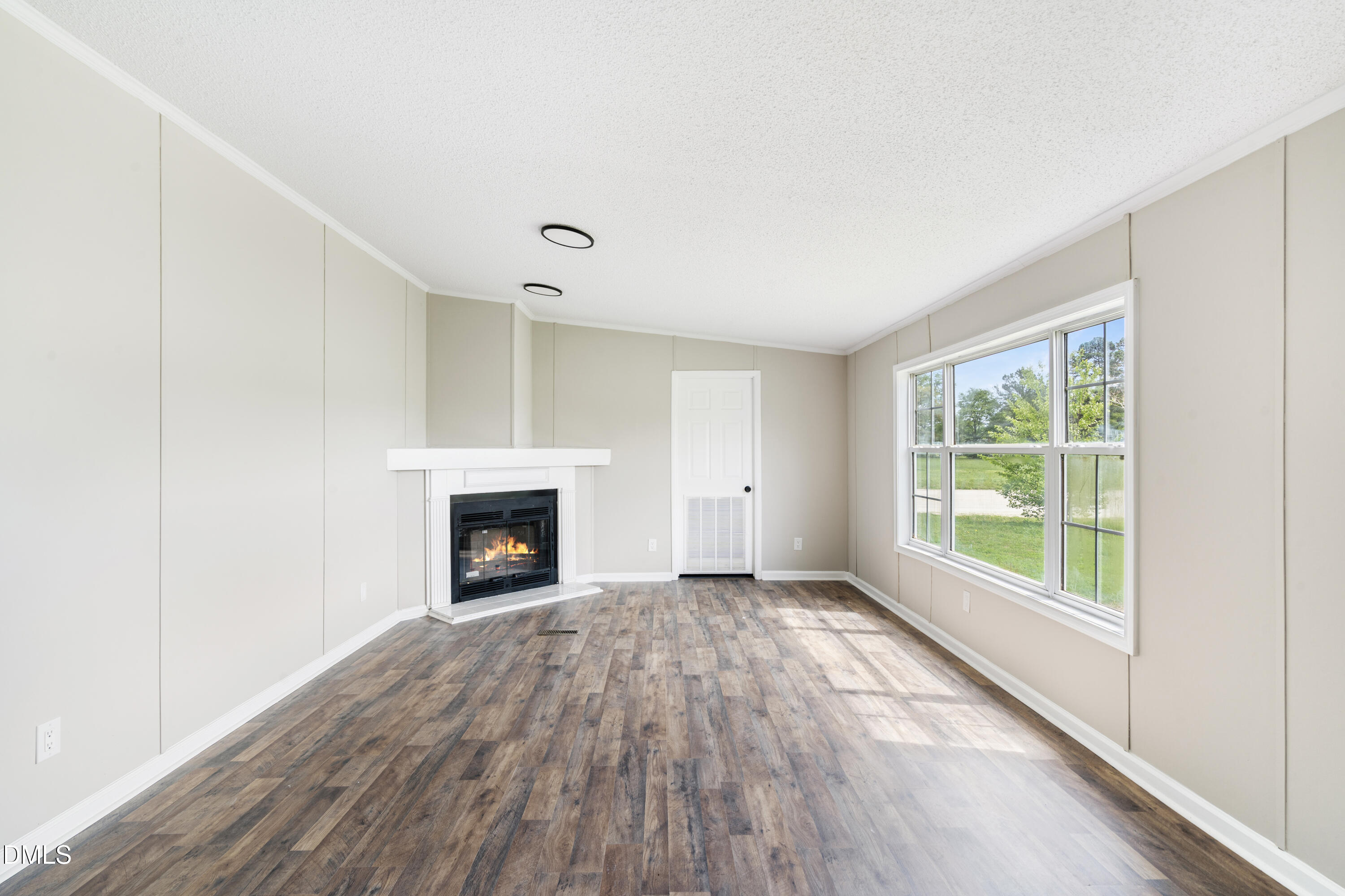 2048 Town Crier Road Kinston, NC 28504 - Photo 19 of 48 a view of an empty room with window and fire place