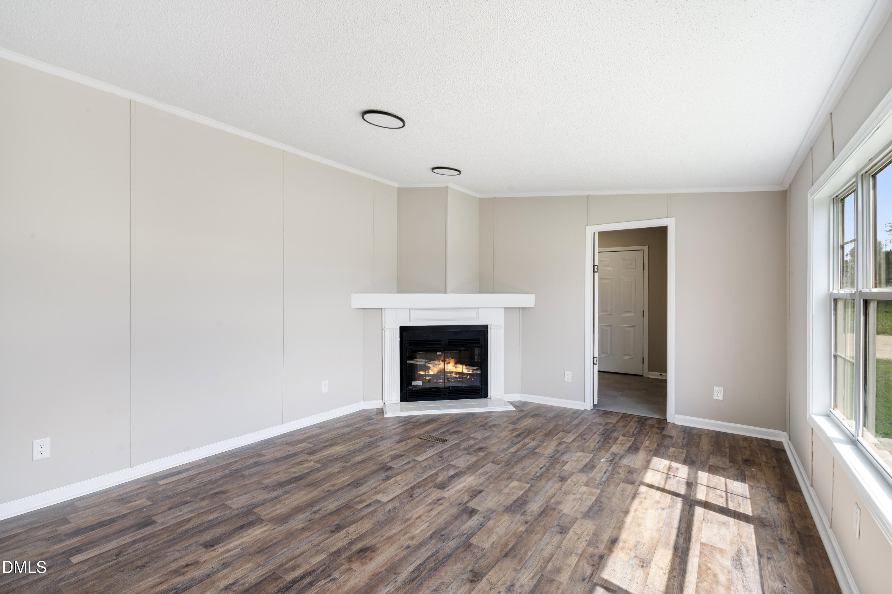 2048 Town Crier Road Kinston, NC 28504 - Photo 20 of 48 a view of an empty room with window and fire place