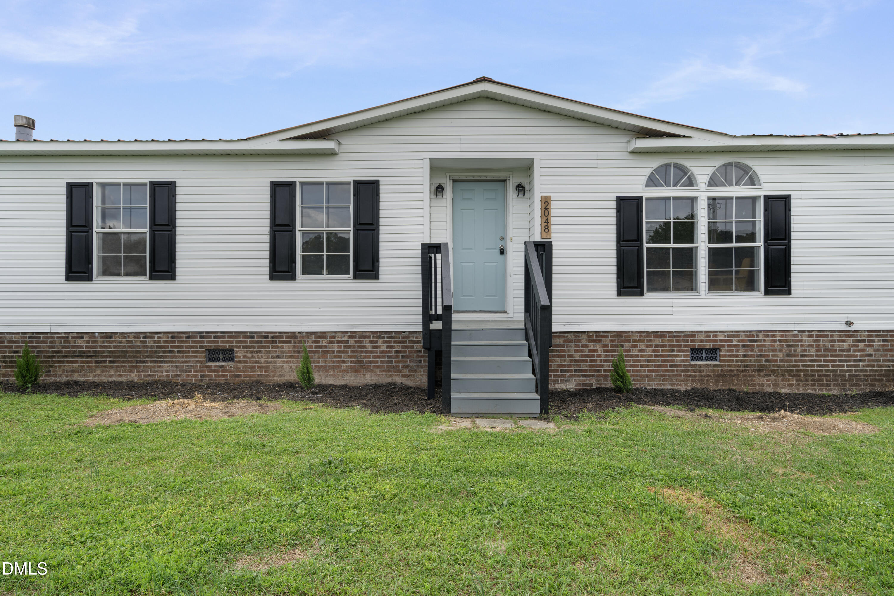 2048 Town Crier Road Kinston, NC 28504 - Photo 2 of 48 front view of a house with a yard