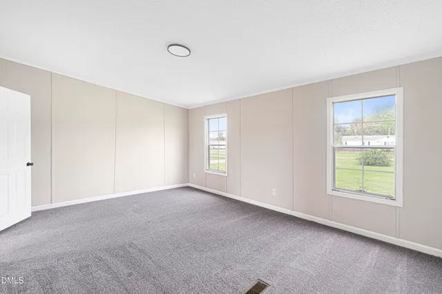 an empty room with windows