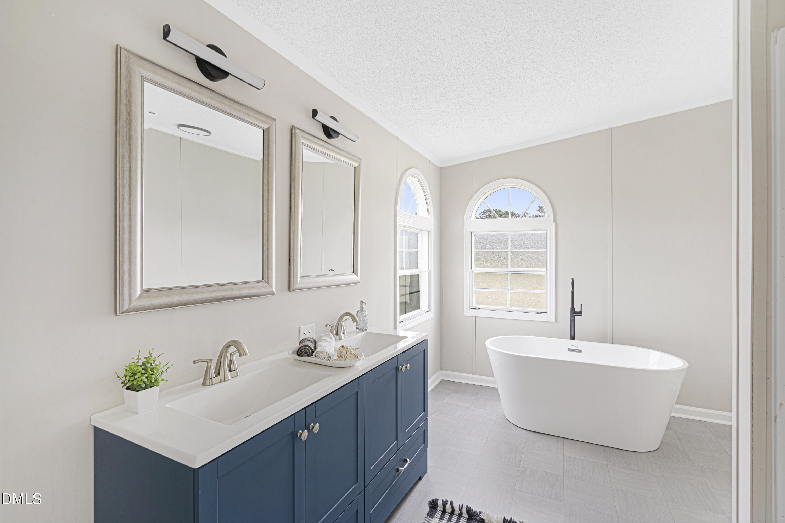 2048 Town Crier Road Kinston, NC 28504 - Photo 27 of 48 a bathroom with a double vanity sink mirror and bathtub