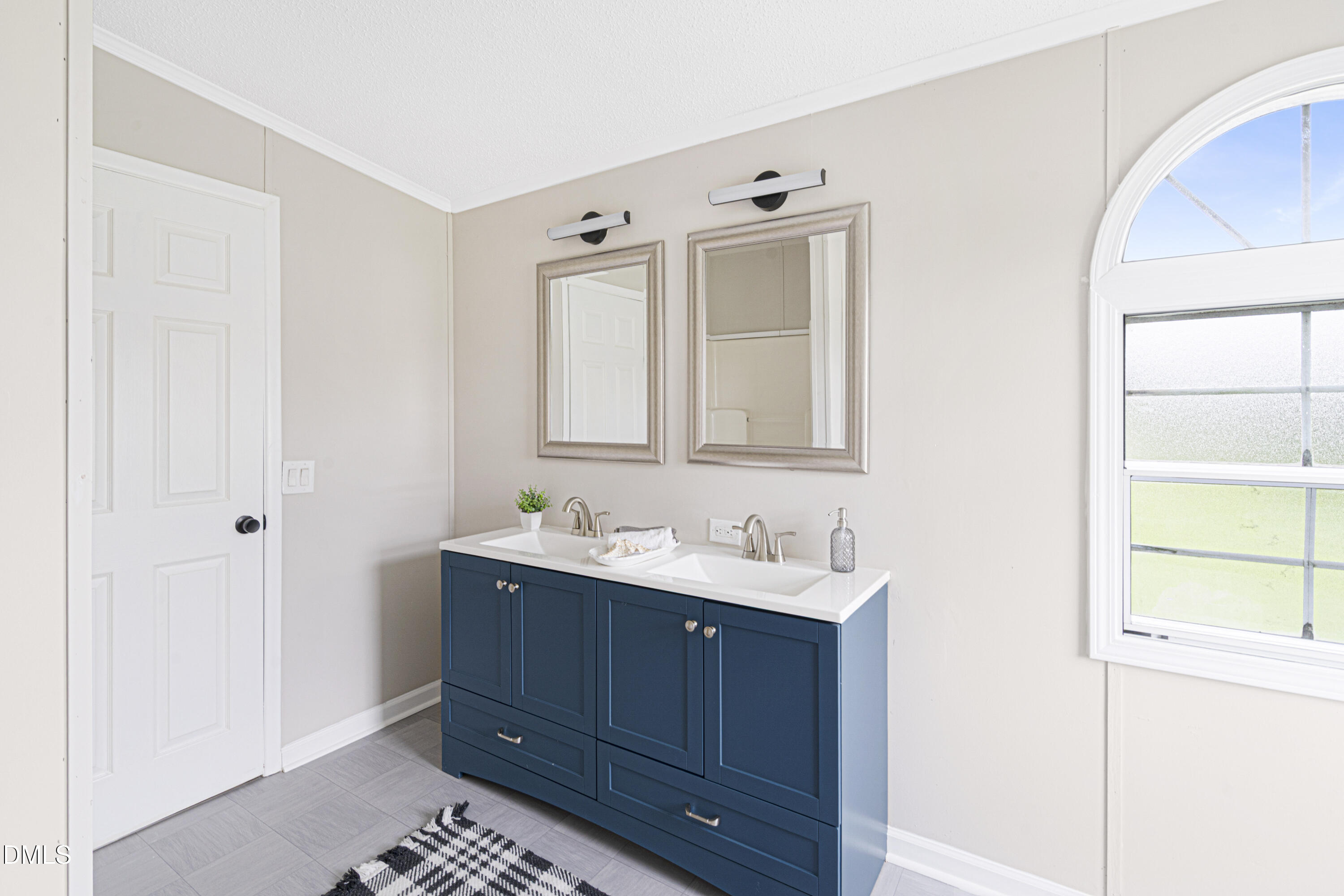 2048 Town Crier Road Kinston, NC 28504 - Photo 28 of 48 a bathroom with a sink and a mirror