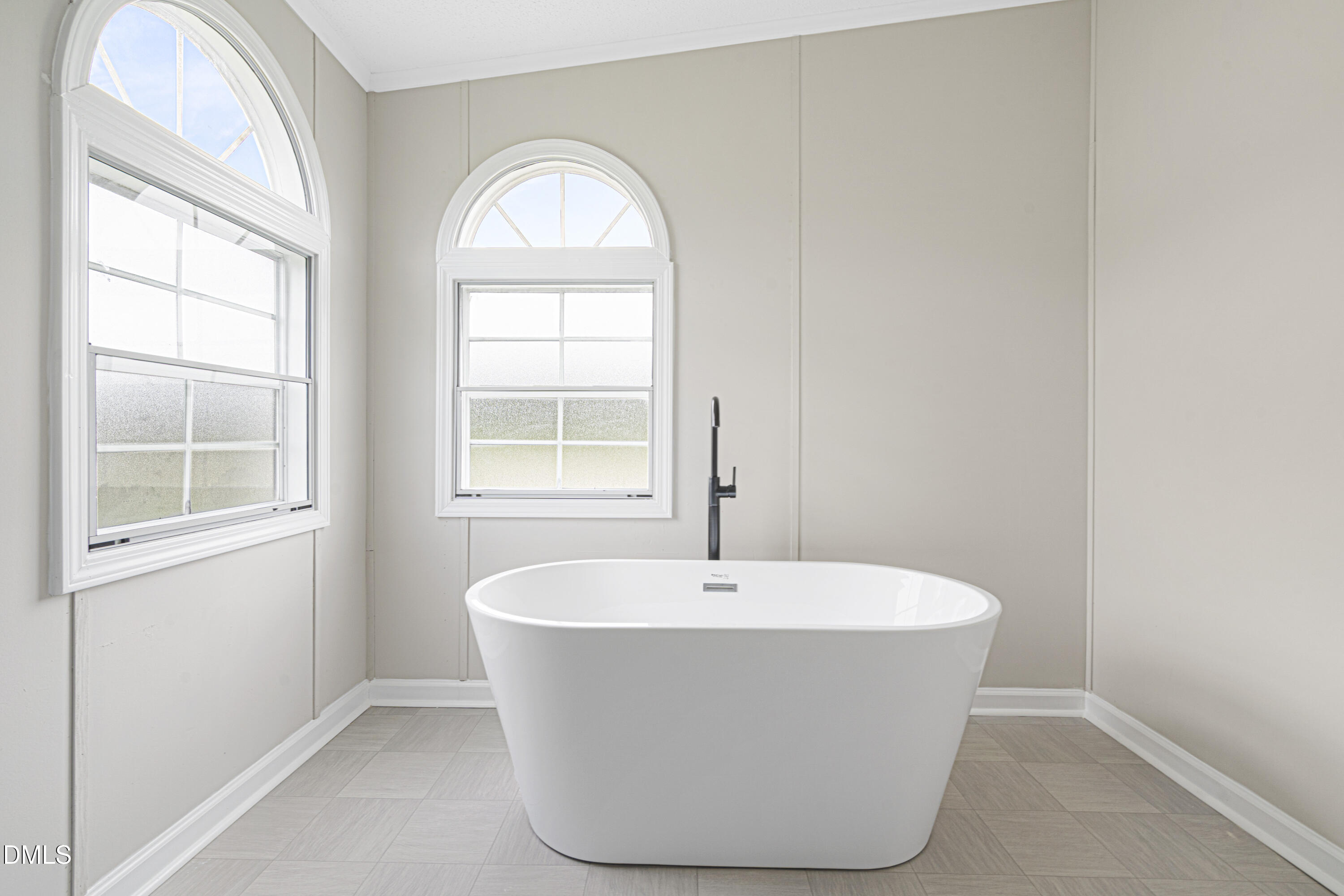 2048 Town Crier Road Kinston, NC 28504 - Photo 29 of 48 a white bath tub sitting in a bathroom next to a window