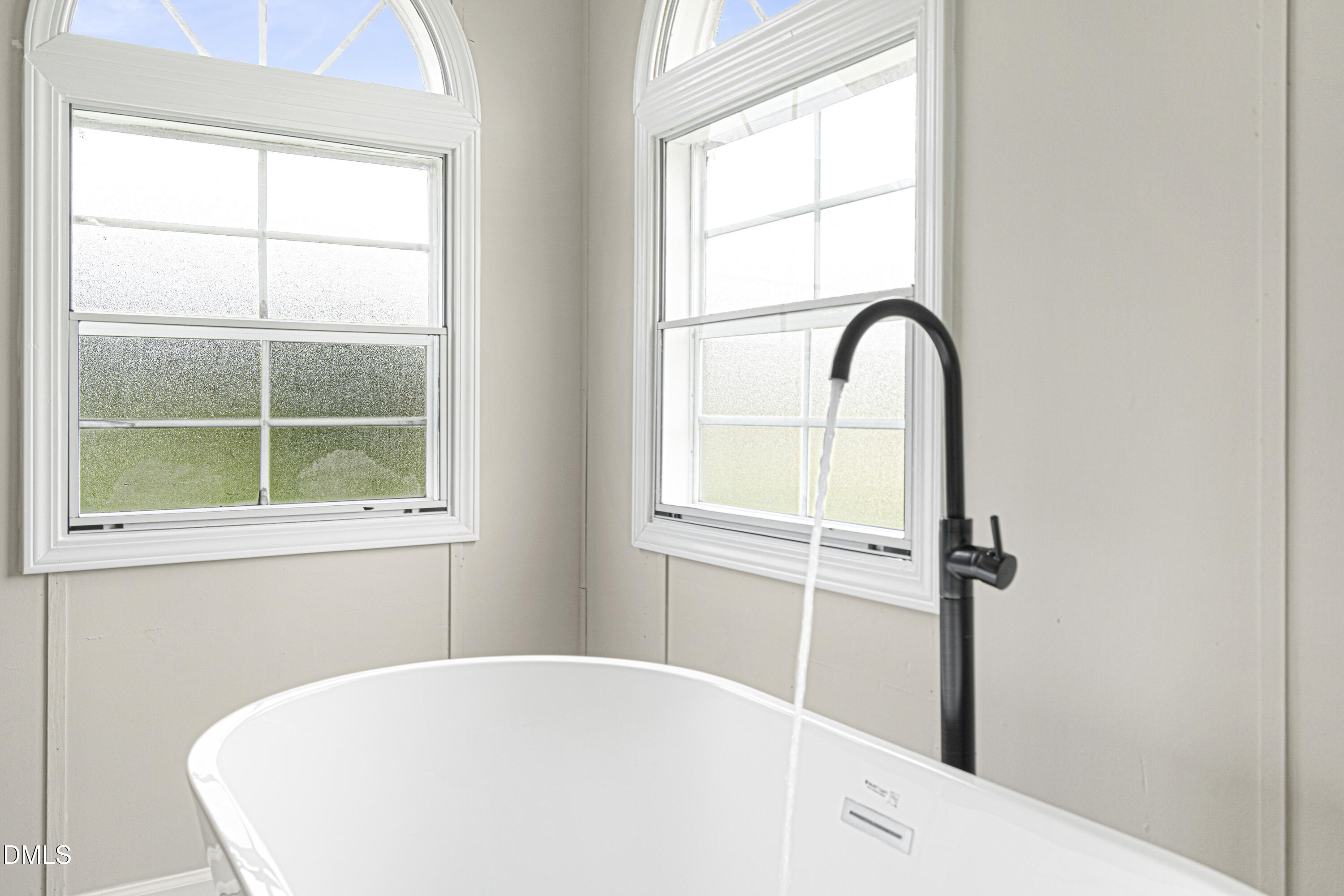 2048 Town Crier Road Kinston, NC 28504 - Photo 30 of 48 a white bath tub sitting next to a window