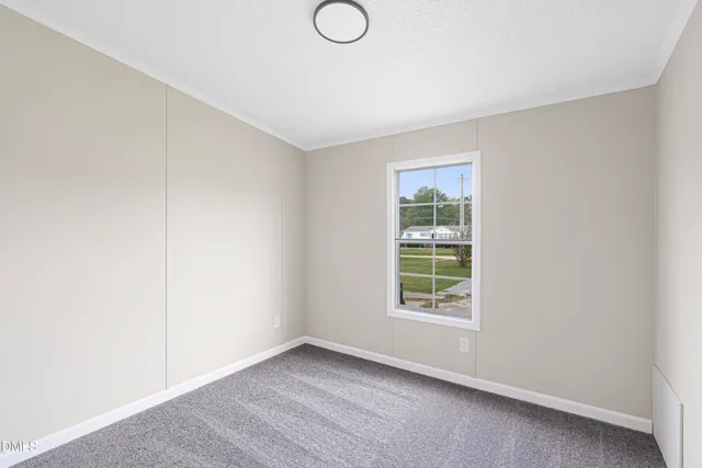 a bathroom with a toilet sink vanity and mirror