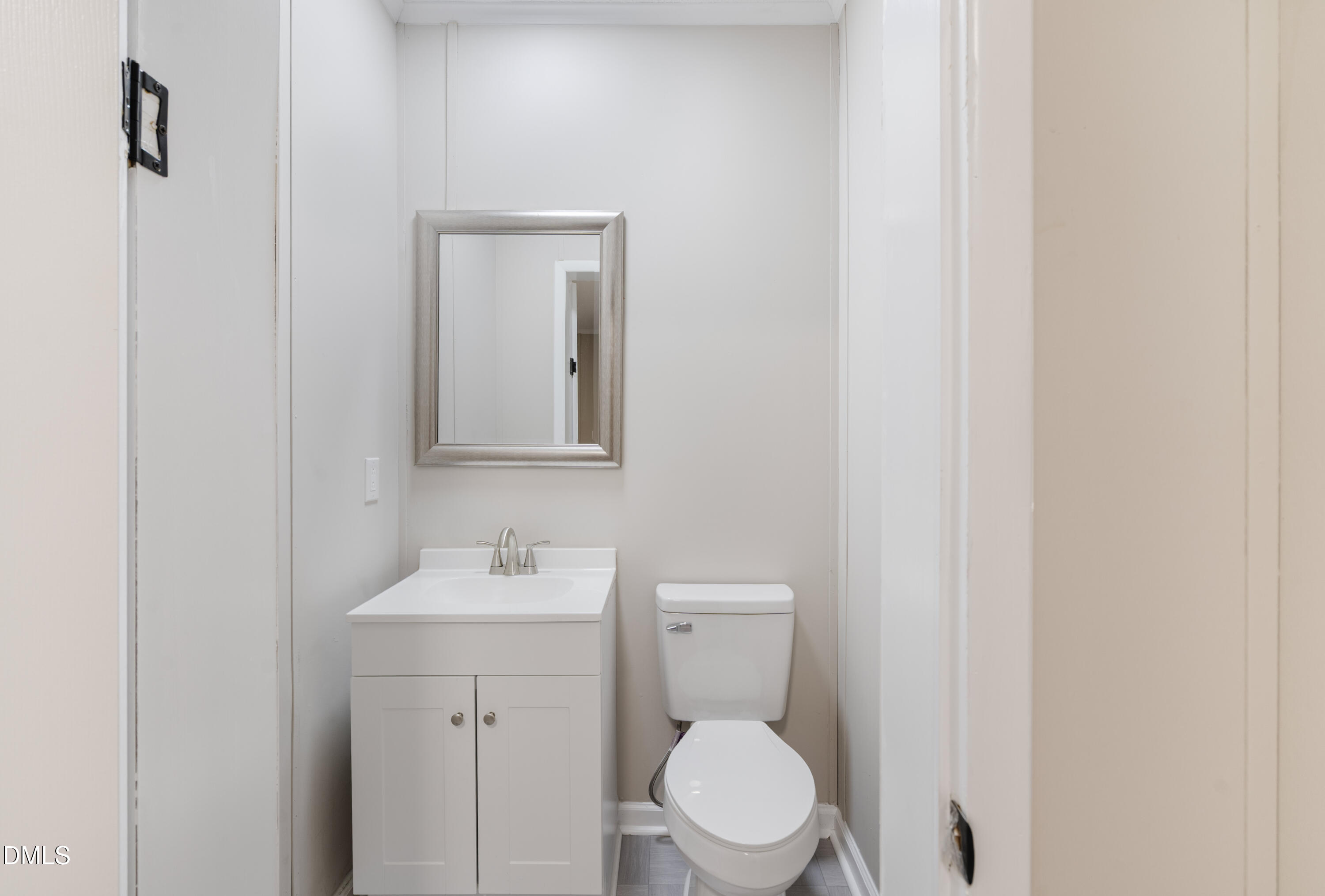 2048 Town Crier Road Kinston, NC 28504 - Photo 39 of 48 a bathroom with a toilet sink and mirror