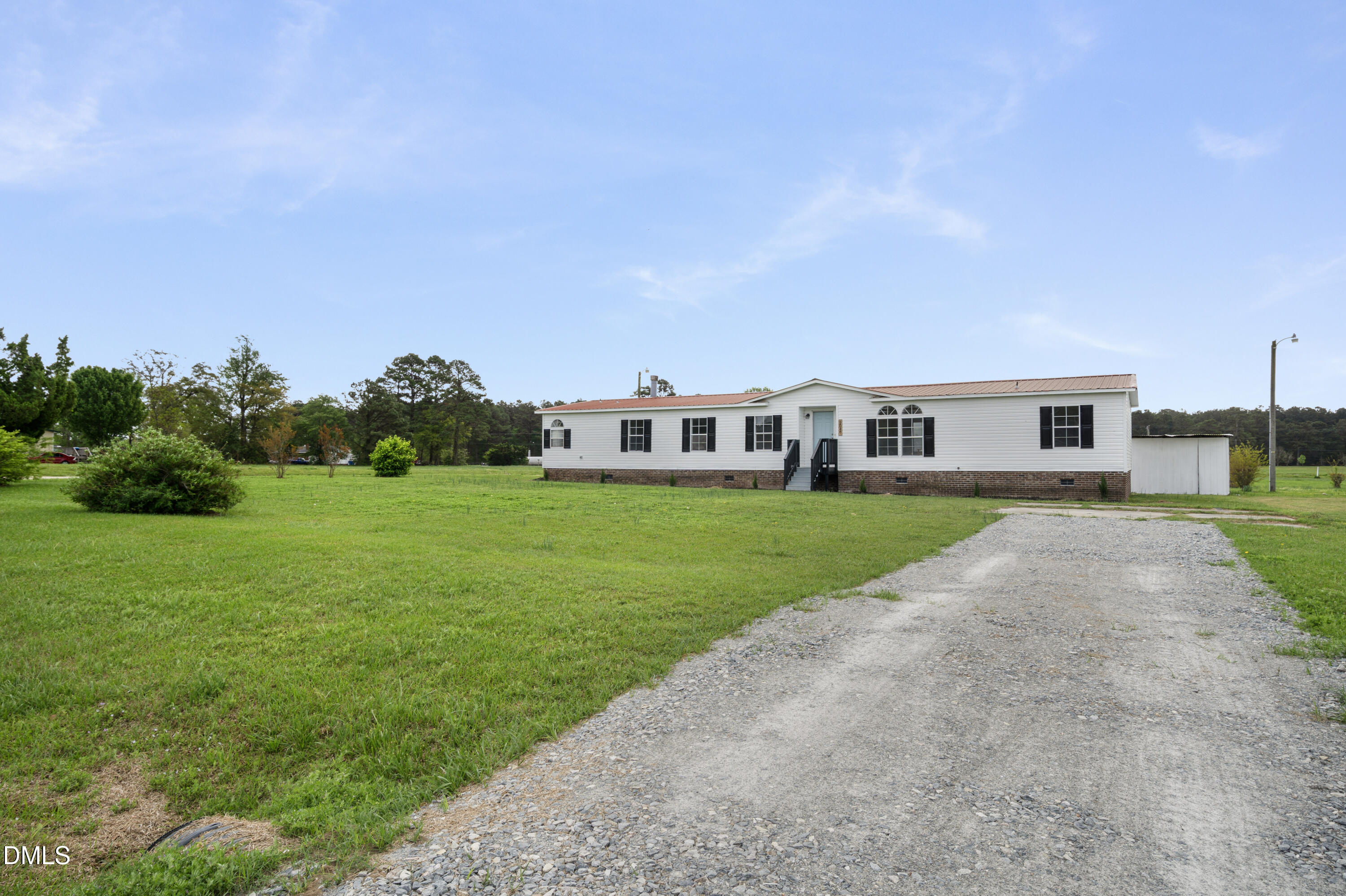 2048 Town Crier Road Kinston, NC 28504 - Photo 4 of 48 a view of house with a big yard