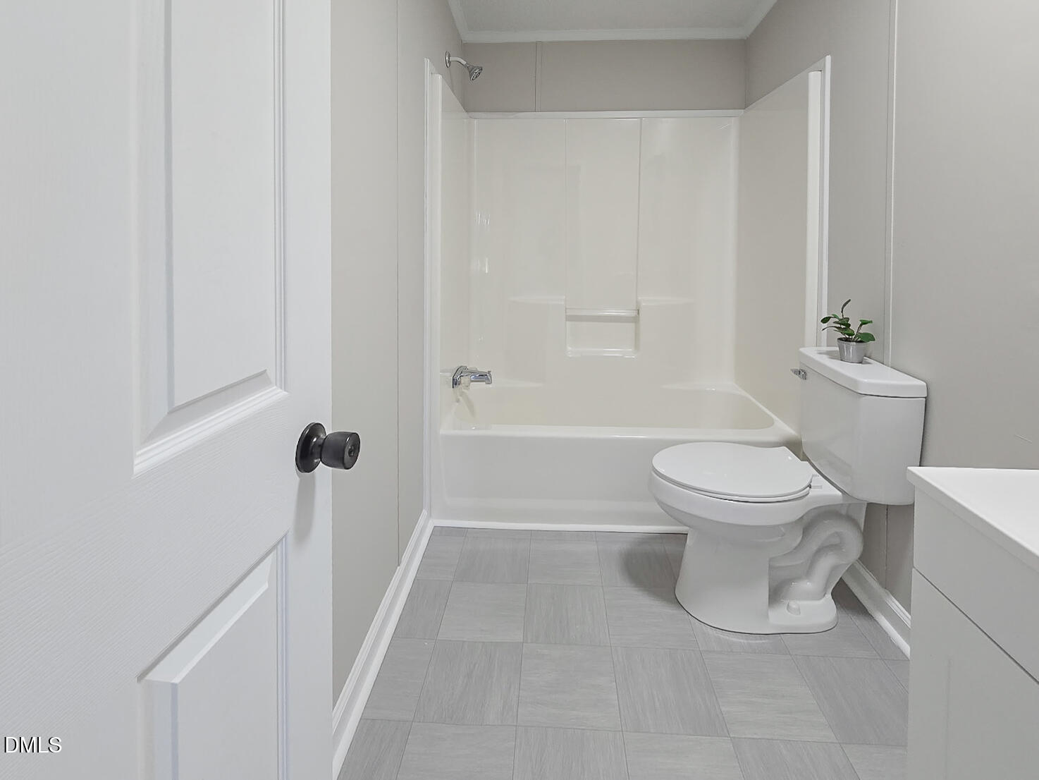 2048 Town Crier Road Kinston, NC 28504 - Photo 41 of 48 a white toilet sitting next to a bathroom sink and tub